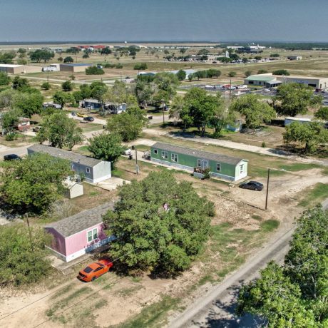 A rustic mobile home community surrounded by big Texas skies and sprawling landscapes at Sunset Mobile Home Park in Hondo, TX.